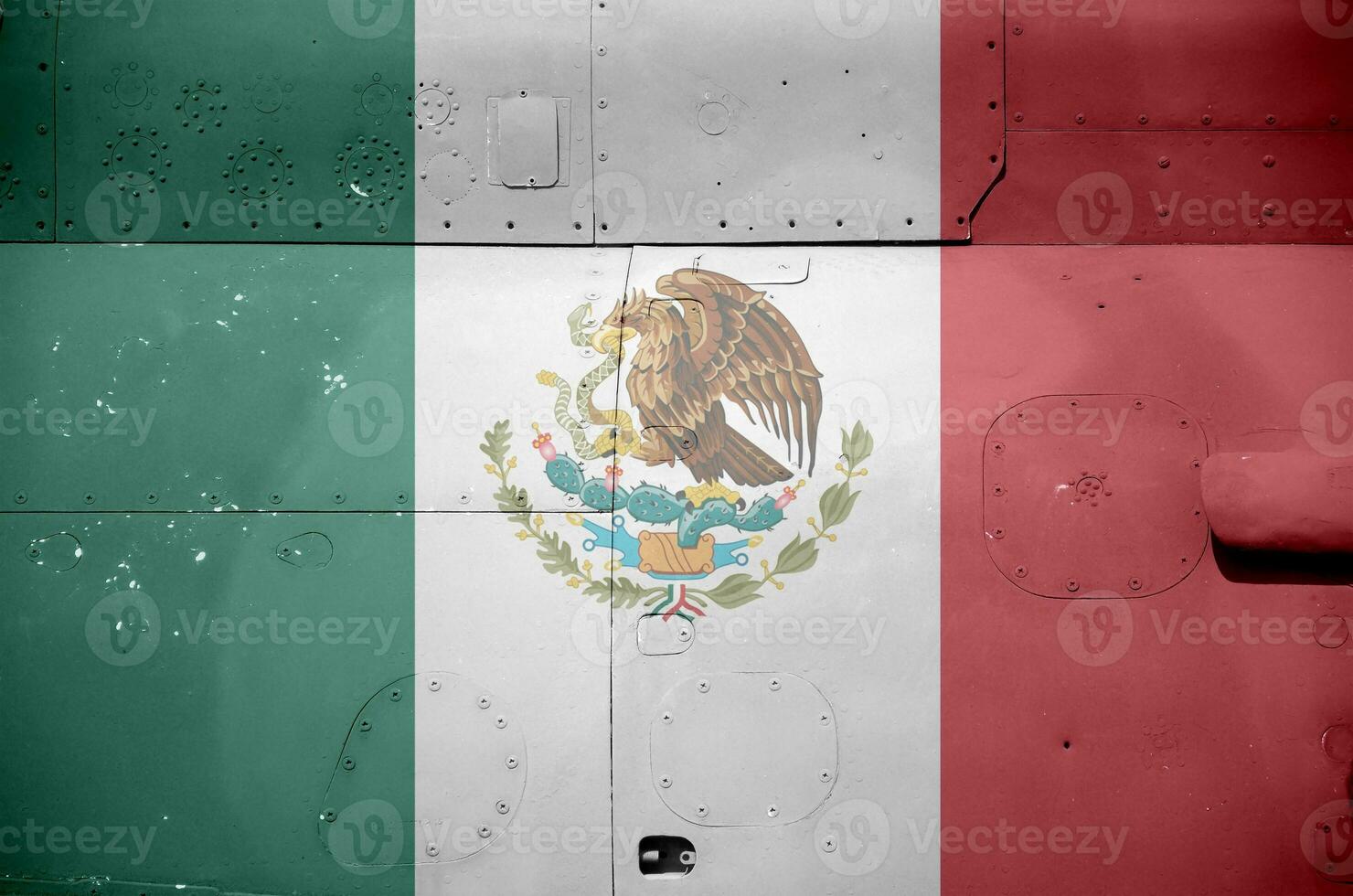 Mexico flag depicted on side part of military armored helicopter closeup. Army forces aircraft conceptual background photo