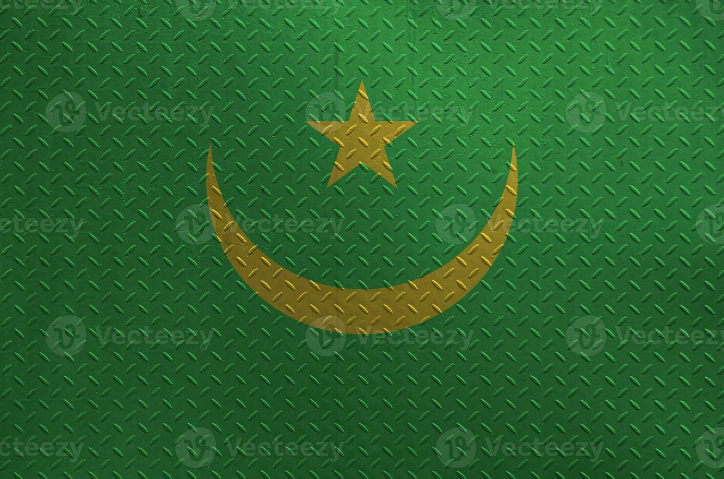 Mauritania flag depicted in paint colors on old brushed metal plate or wall closeup. Textured banner on rough background photo