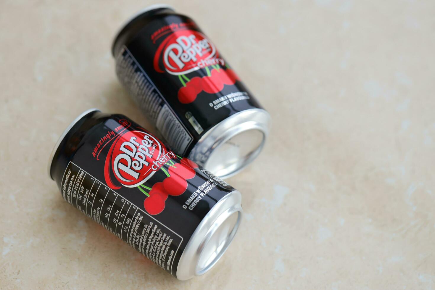 KYIV, UKRAINE - 4 MAY, 2023 Dr Pepper cherry drink black cans photo