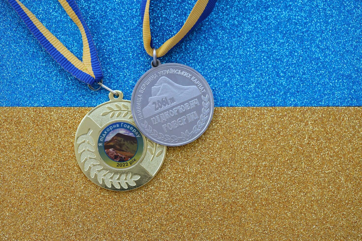 KYIV, UKRAINE - MAY 4, 2022 Medal for the person who conquered Mount Hoverla photo