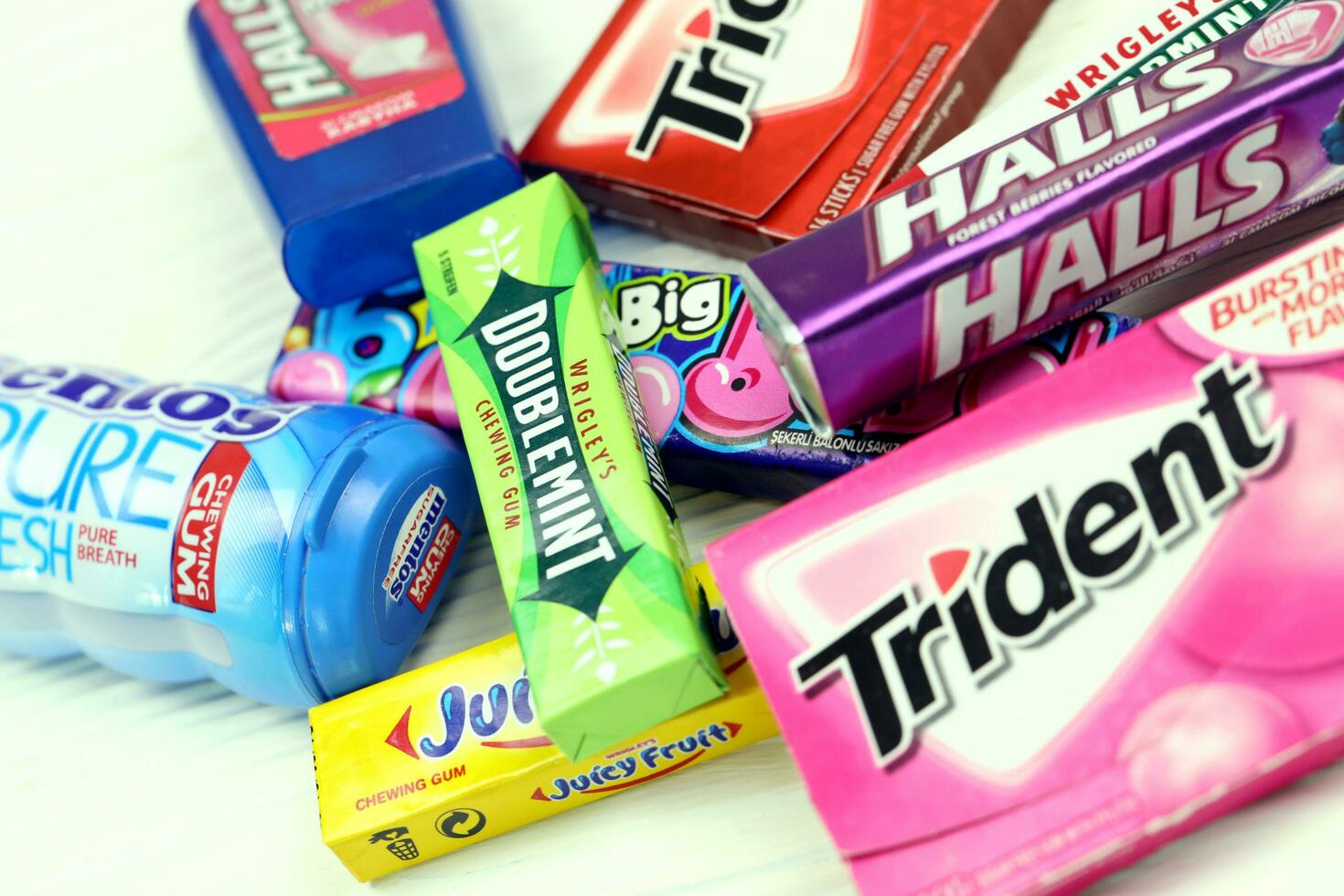KHARKOV, UKRAINE - JULY 2, 2021 Many chewing gum packs in various flavors and design. photo