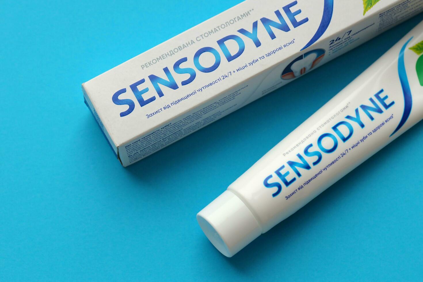 KYIV, UKRAINE - MAY 4, 2022 Sensodyne fluorine or fluor is a daily fluoride toothpaste photo