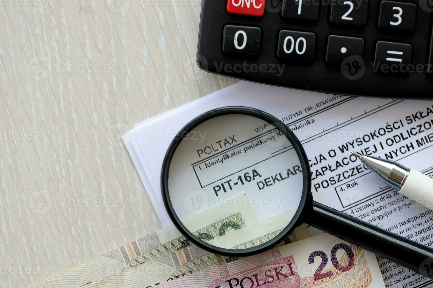 Declaration of amount of health insurance contributions paid and deducted from tax card in individual months of tax year, PIT-16A form on accountant table with pen and polish zloty money photo