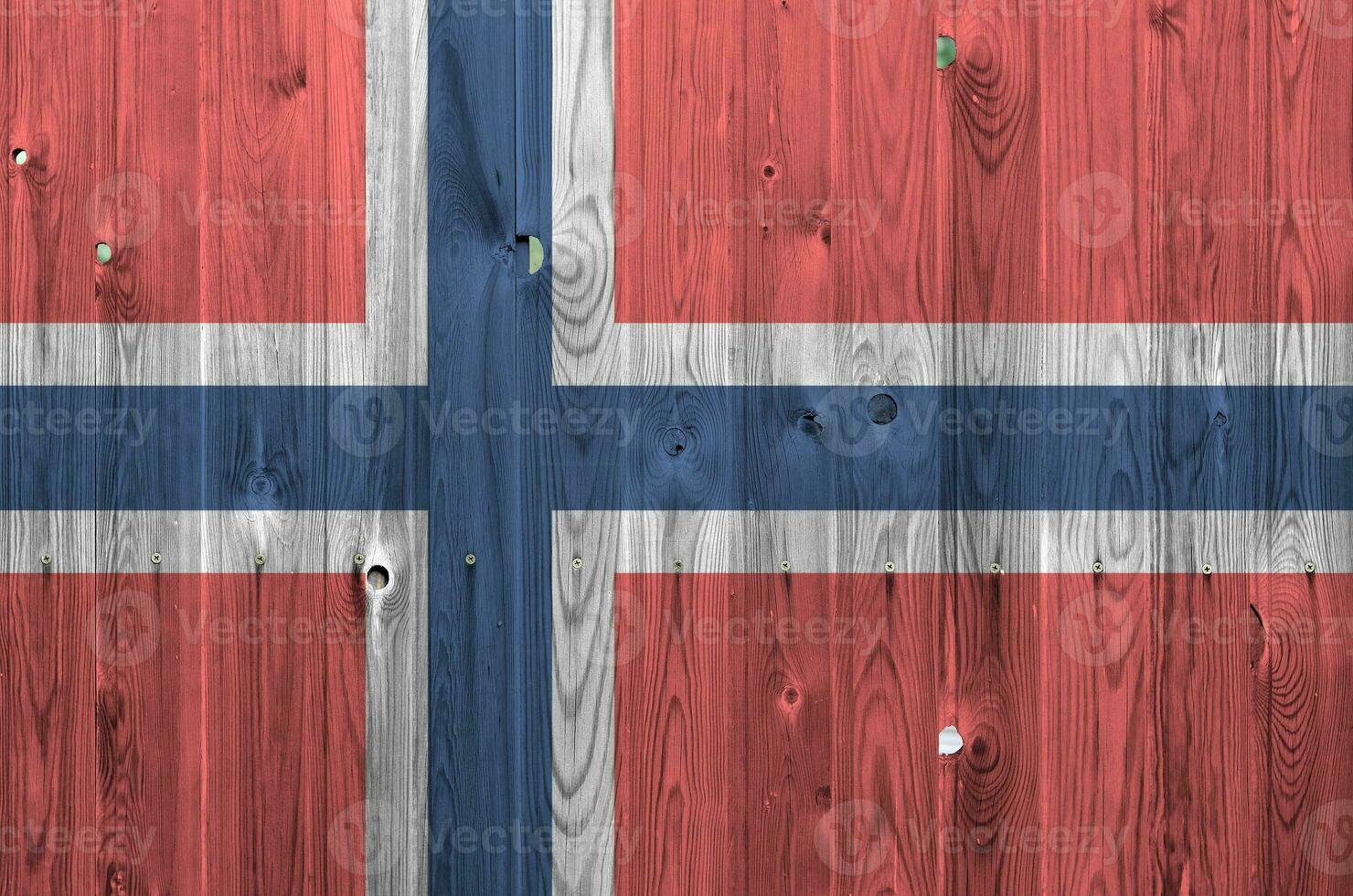 Norway flag depicted in bright paint colors on old wooden wall. Textured banner on rough background photo