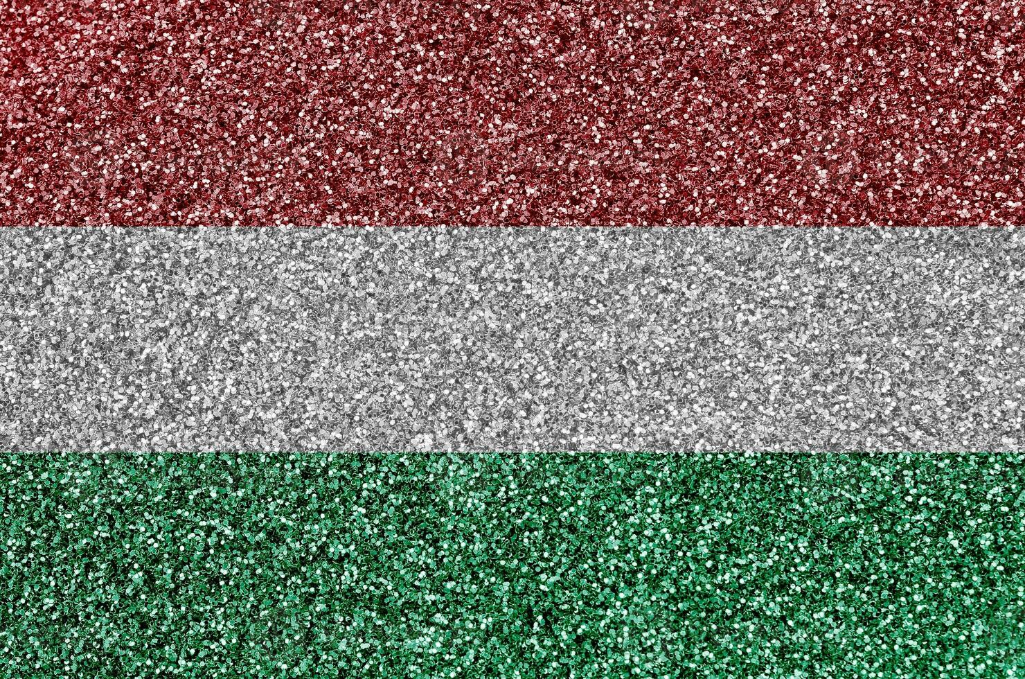 Hungary flag depicted on many small shiny sequins. Colorful festival background for party photo