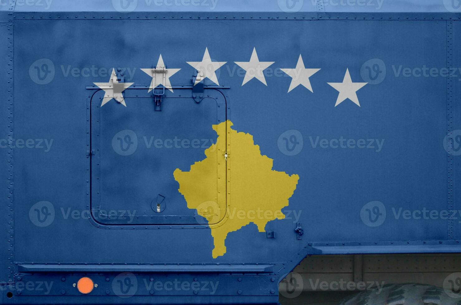 Kosovo flag depicted on side part of military armored truck closeup. Army forces conceptual background photo