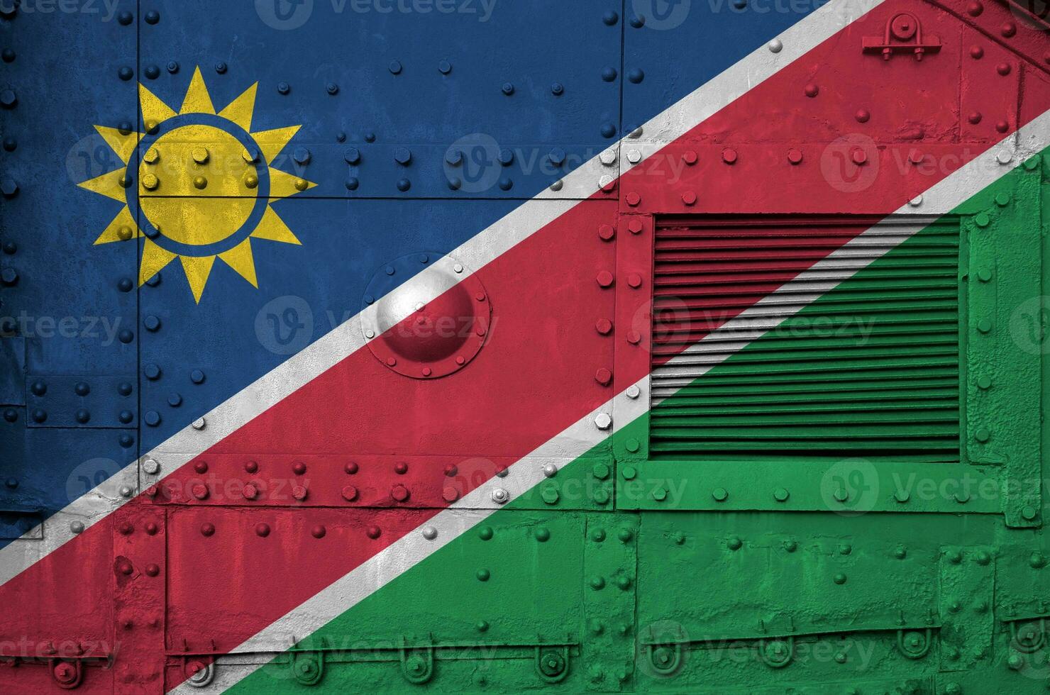 Namibia flag depicted on side part of military armored tank closeup. Army forces conceptual background photo