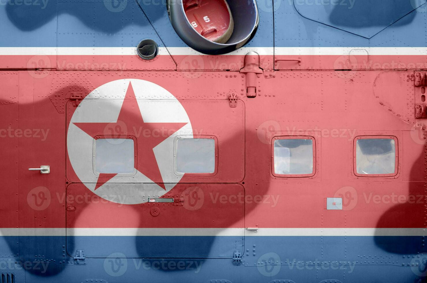 norte Corea bandera representado en lado parte de militar blindado helicóptero de cerca. Ejército efectivo aeronave conceptual antecedentes foto