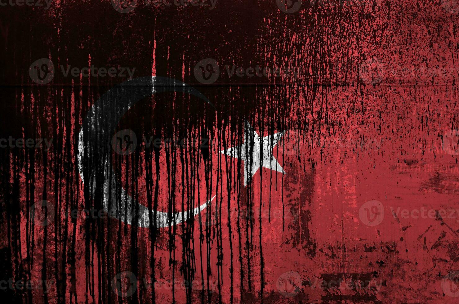 Turkey flag depicted in paint colors on old and dirty oil barrel wall closeup. Textured banner on rough background photo