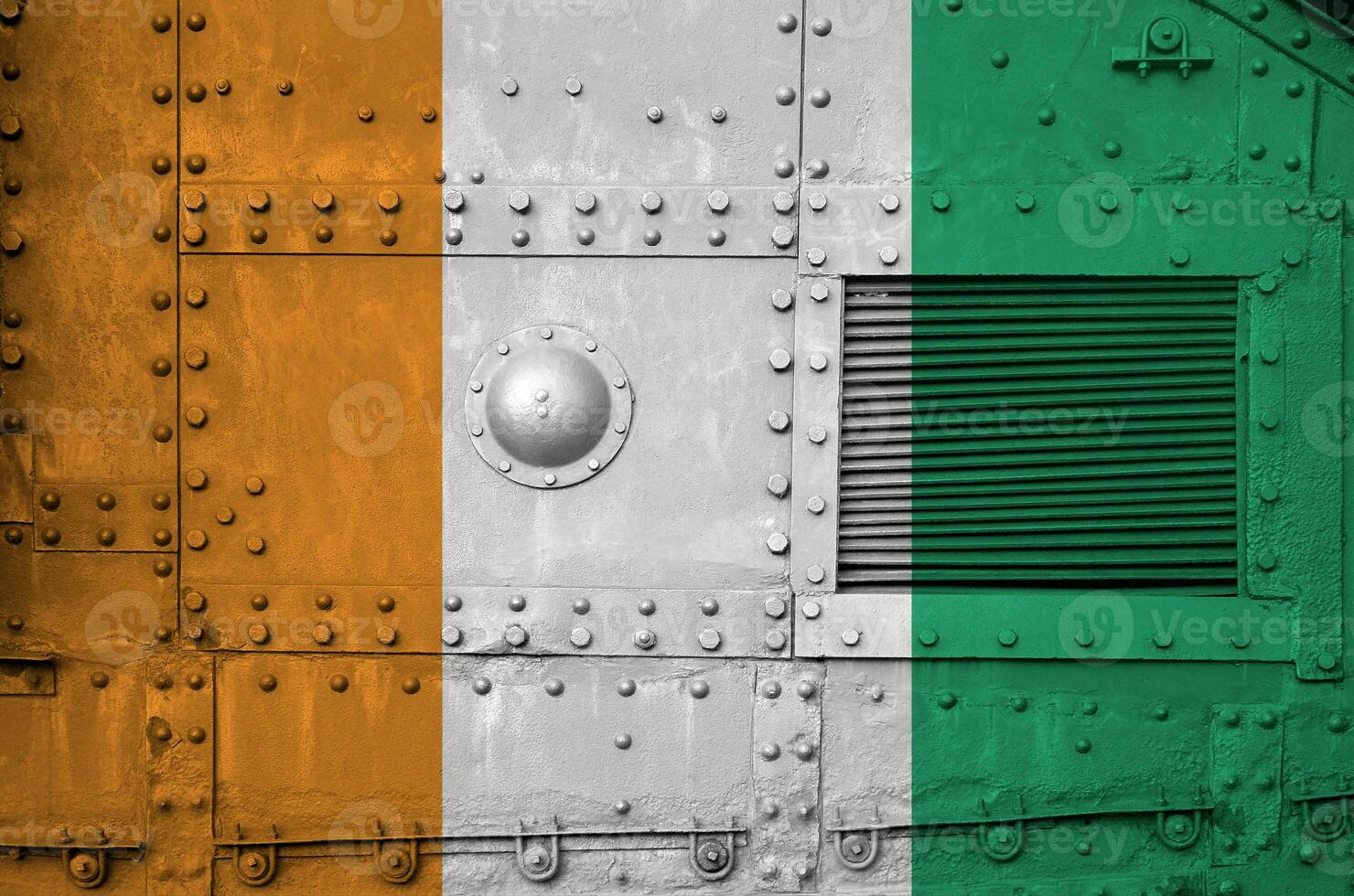 Ivory Coast flag depicted on side part of military armored tank closeup. Army forces conceptual background photo