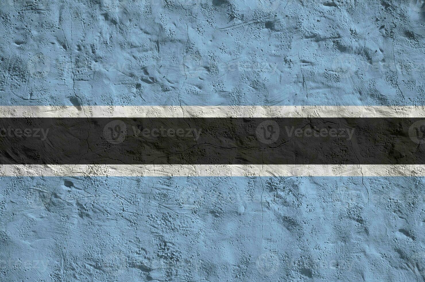 Botswana flag depicted in bright paint colors on old relief plastering wall. Textured banner on rough background photo