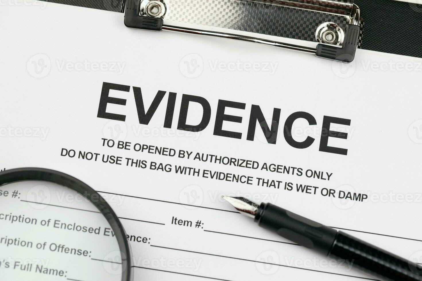Evidence report blank on A4 tablet lies on office table with pen and magnifying glass photo