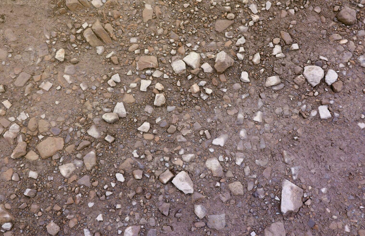 Background of shattered stony stones surface in mountain area. Texture with natural light photo