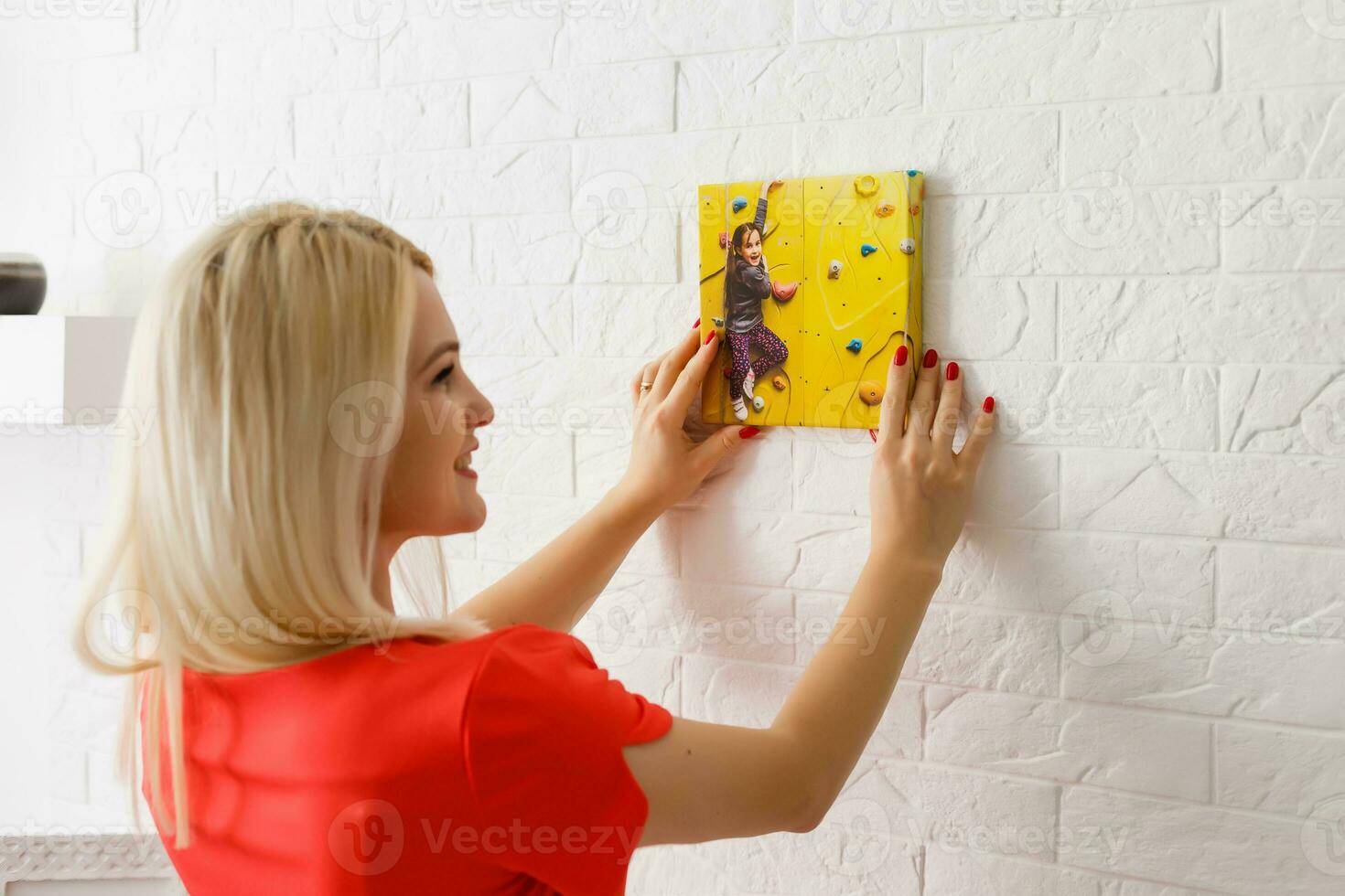 woman holds canvas at home photo