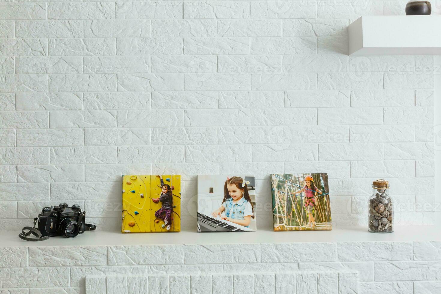 photo canvas on white brick wall collage in the interior