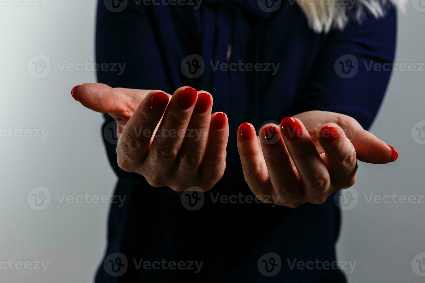 Woman praying with hands folded to God. photo