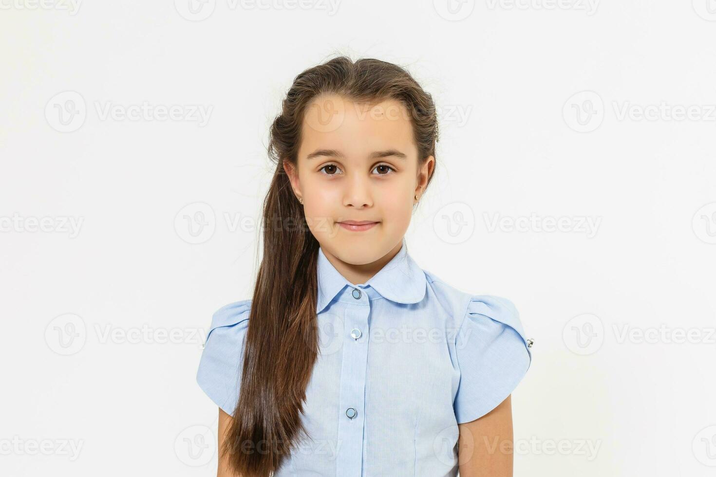 Portrait of a cute 7 years old girl. Isolated over white background. photo