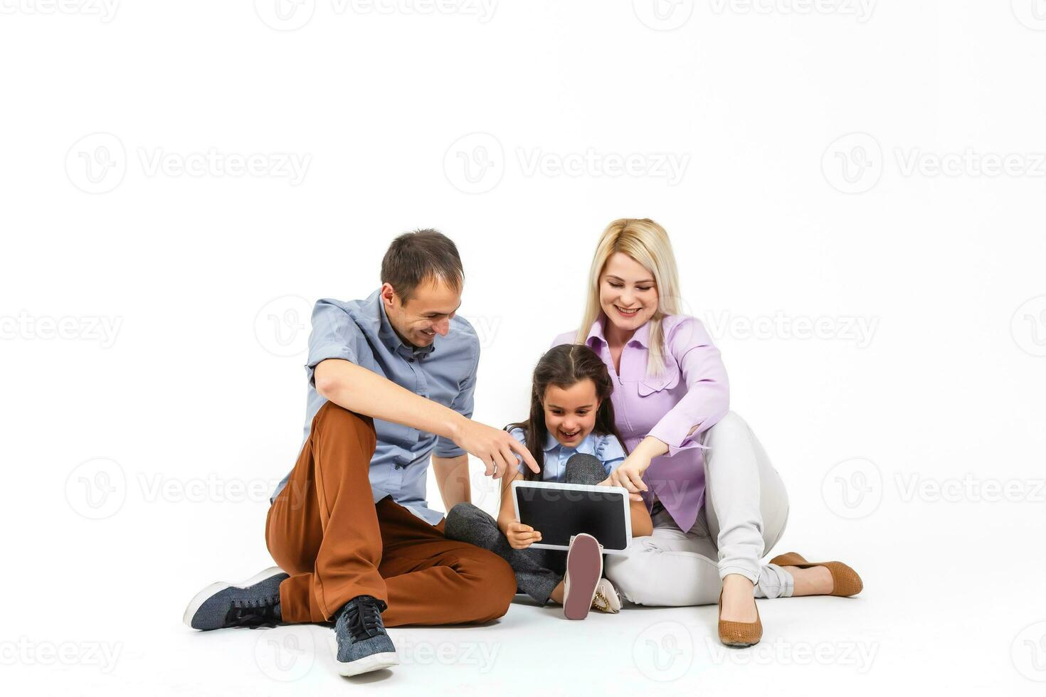 family using digital tablet laptop photo