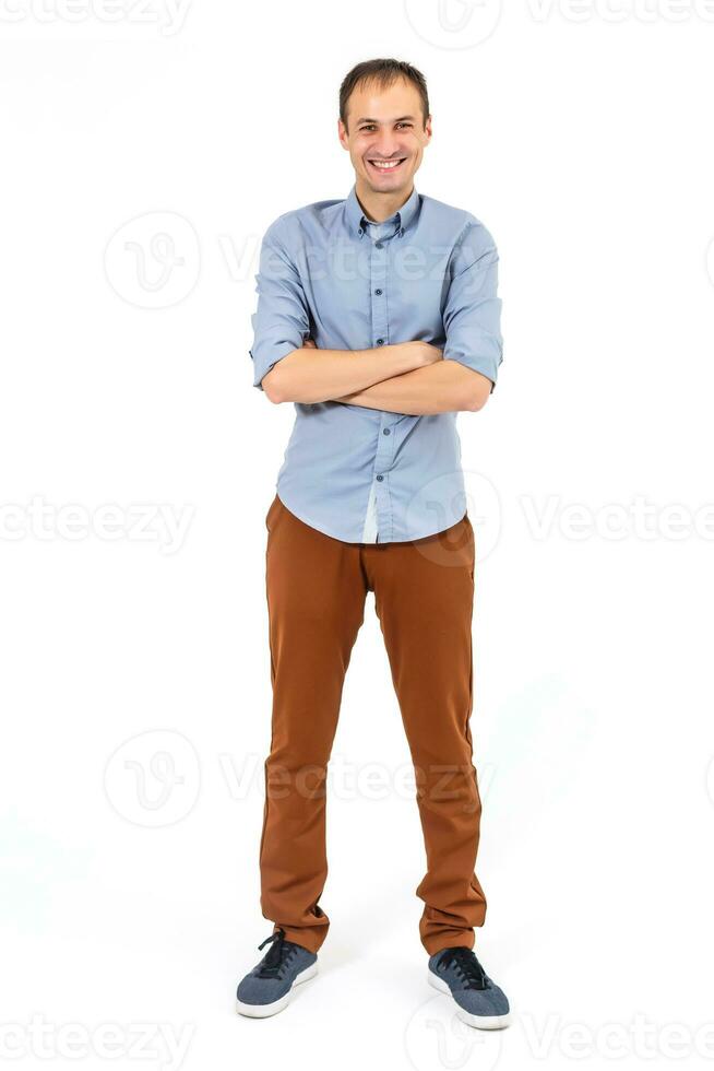 Handsome young man posing in the Studio. portrait in full growth isolated on a white background photo