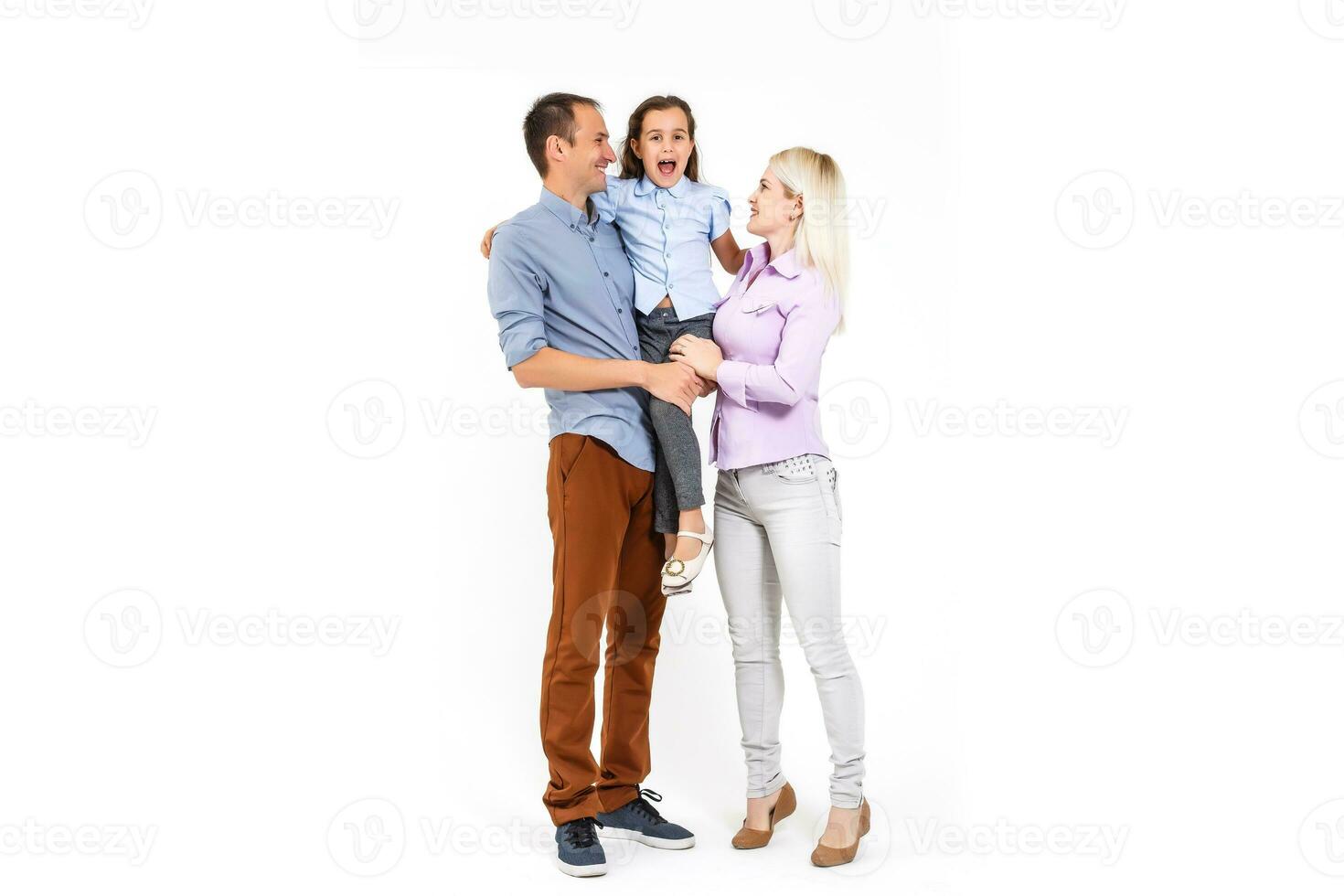Happy young family with pretty child posing on white background photo