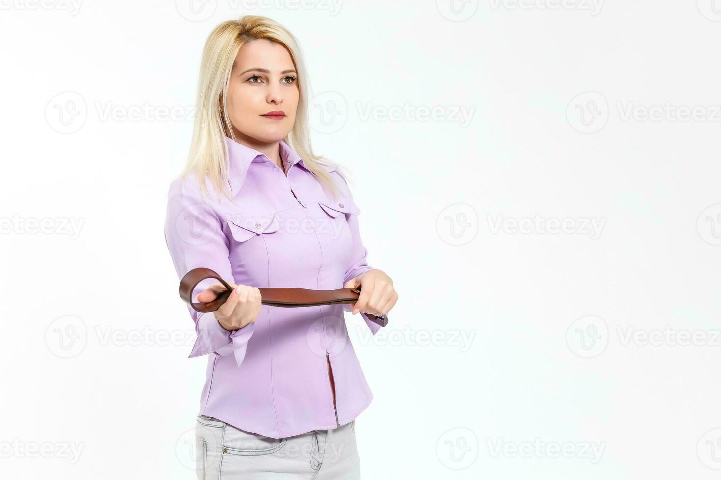 woman holds a belt on a white background photo