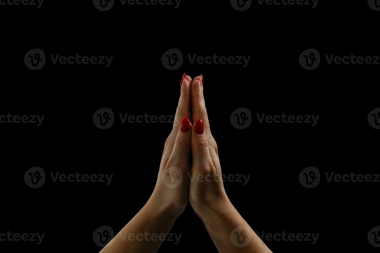 Praying hands on black background photo