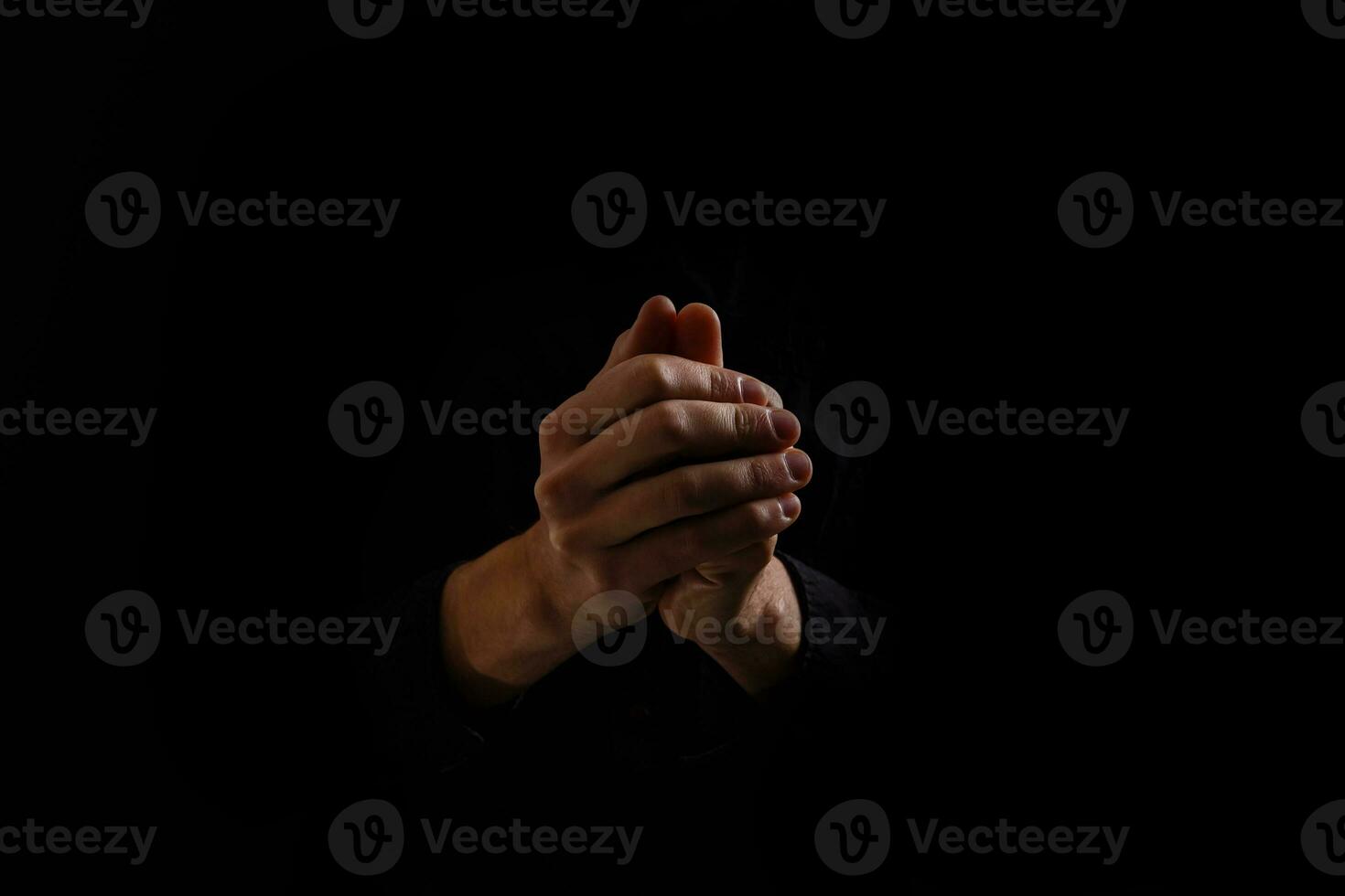 Praying Hands on a black background photo