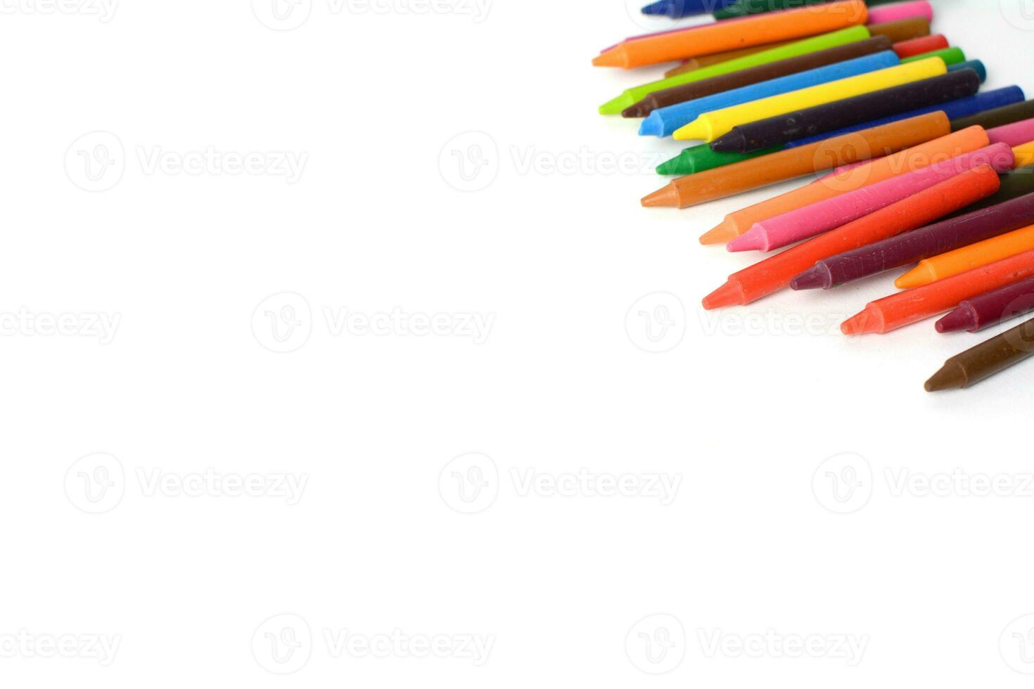 Crayons lined up isolated on white background. photo