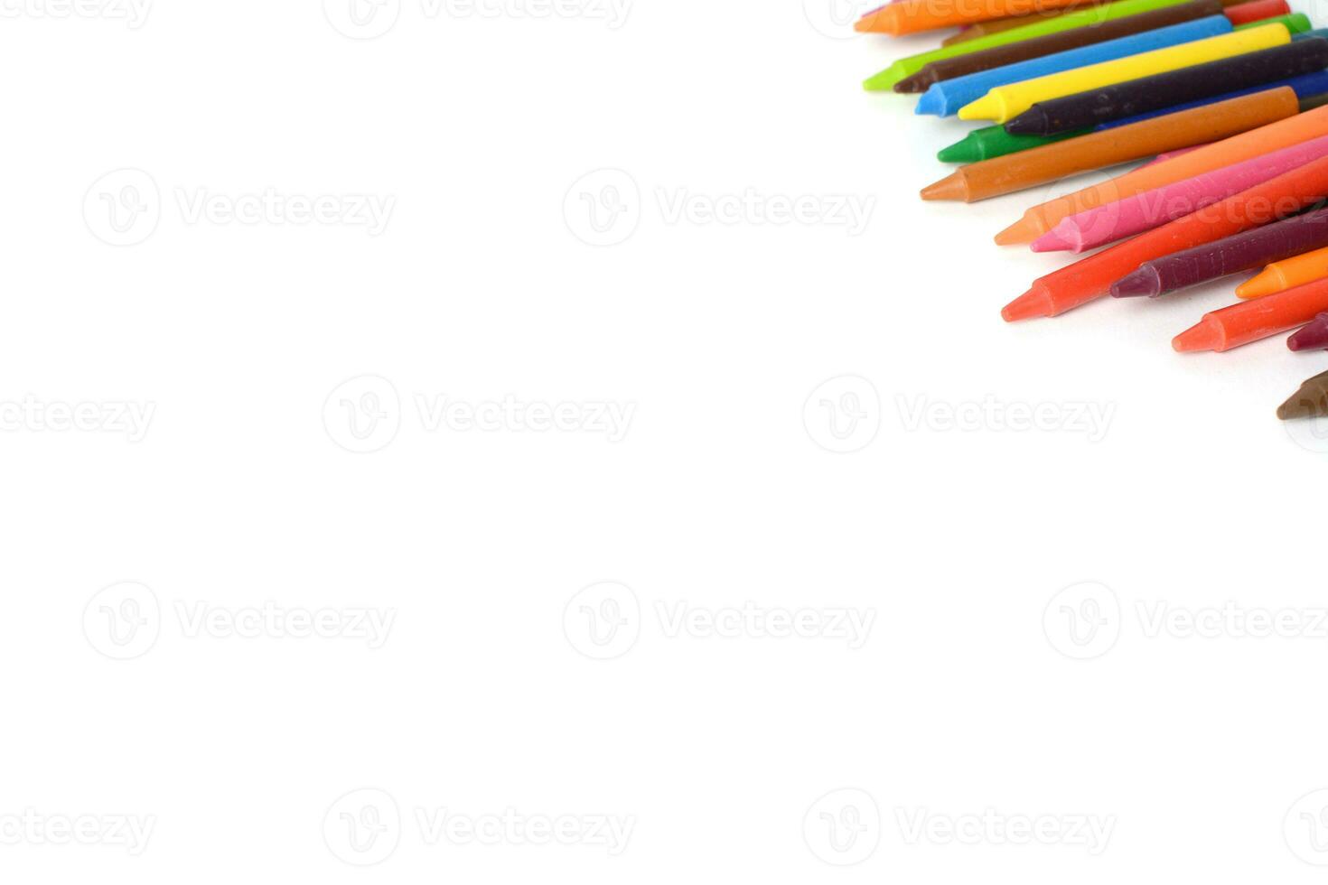 Crayons lined up isolated on white background. photo