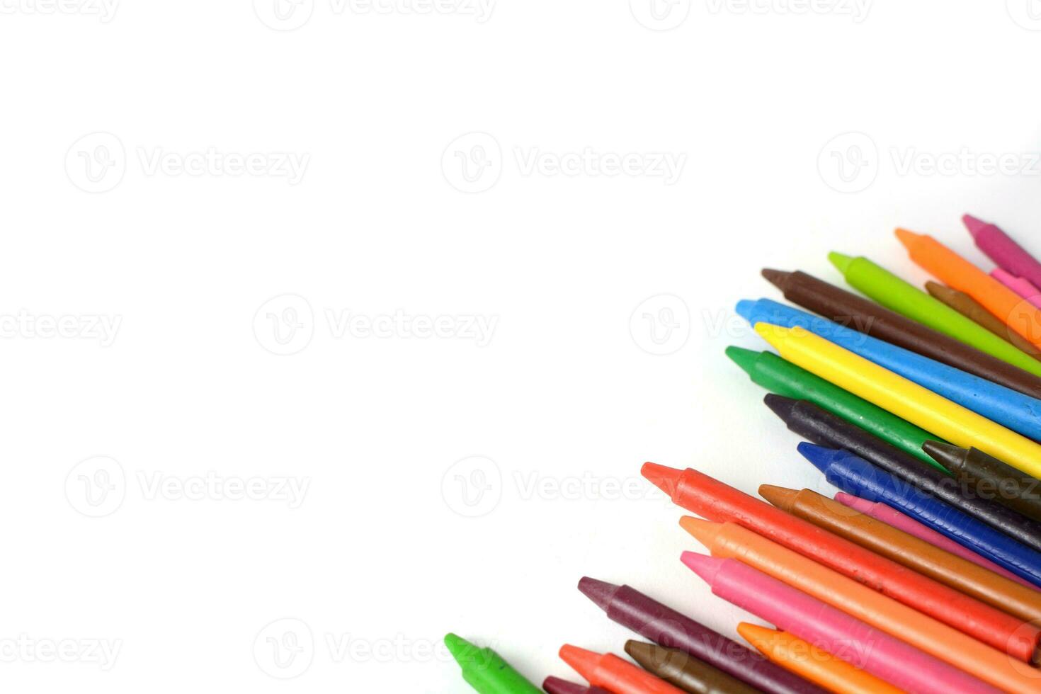 Crayons lined up isolated on white background. photo
