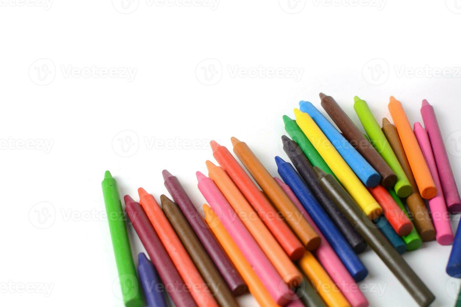 Crayons lined up isolated on white background. photo