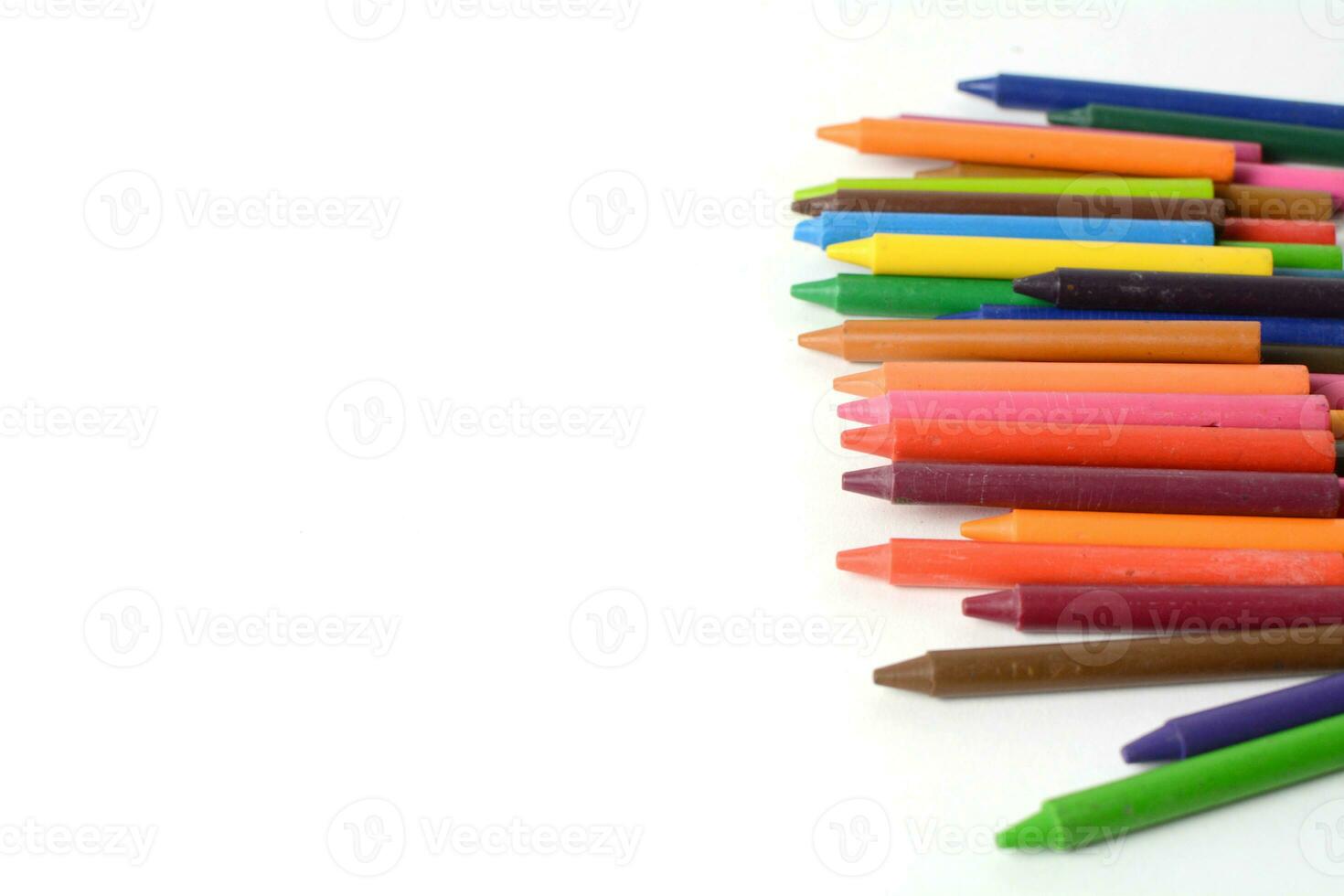 Crayons lined up isolated on white background. photo