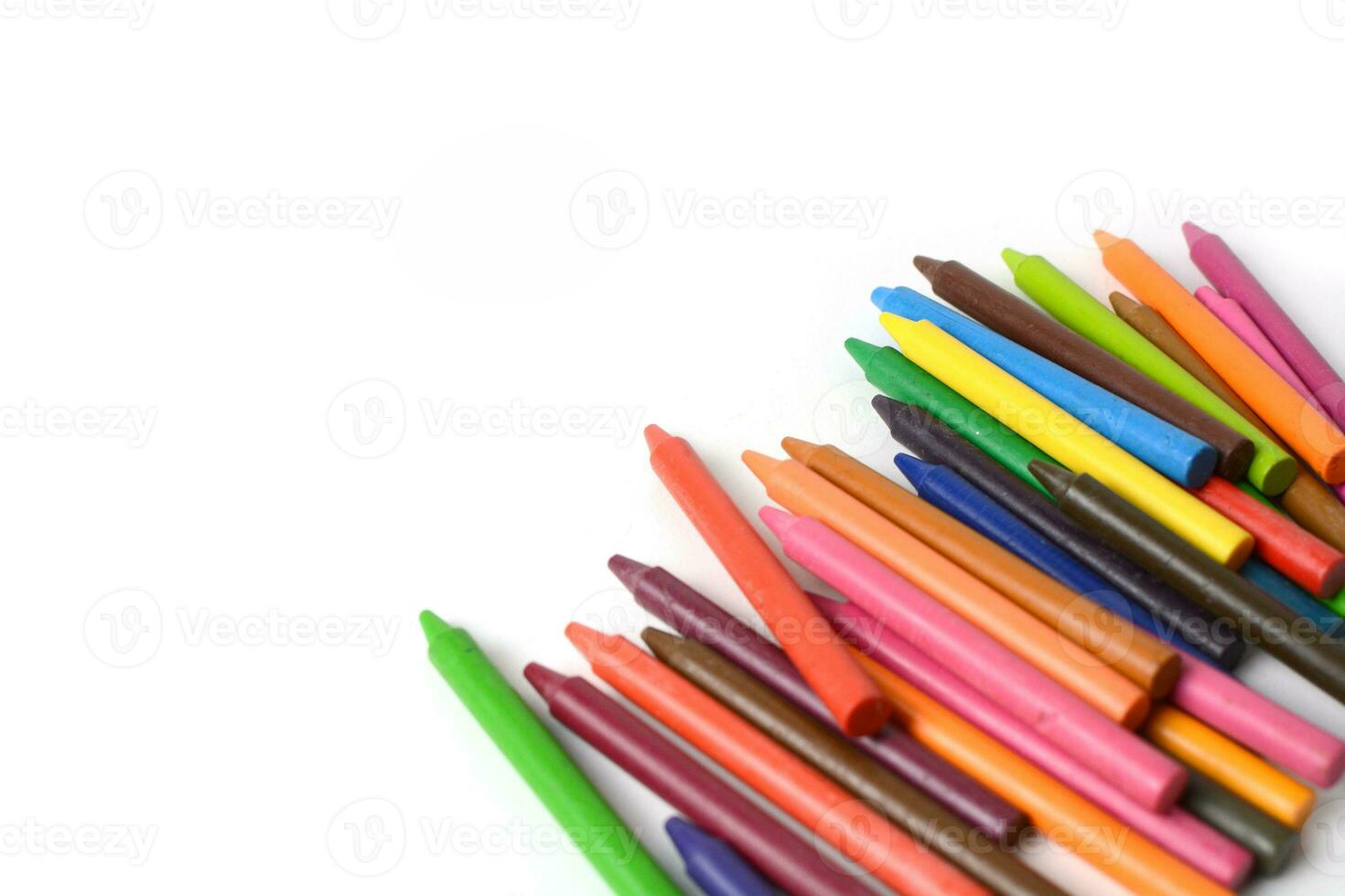 Crayons lined up isolated on white background. photo