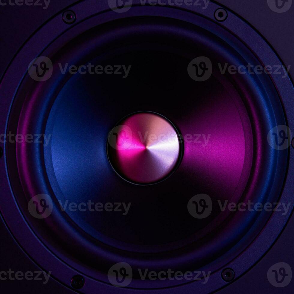 Sound speaker on dark background with neon lights photo