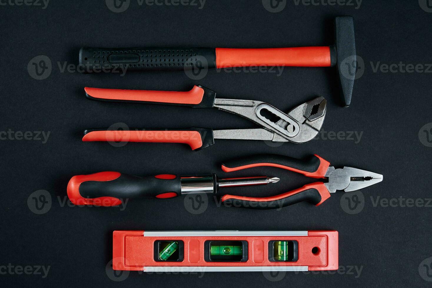 Set of hand tools for repair and maintenance on dark background, close up photo