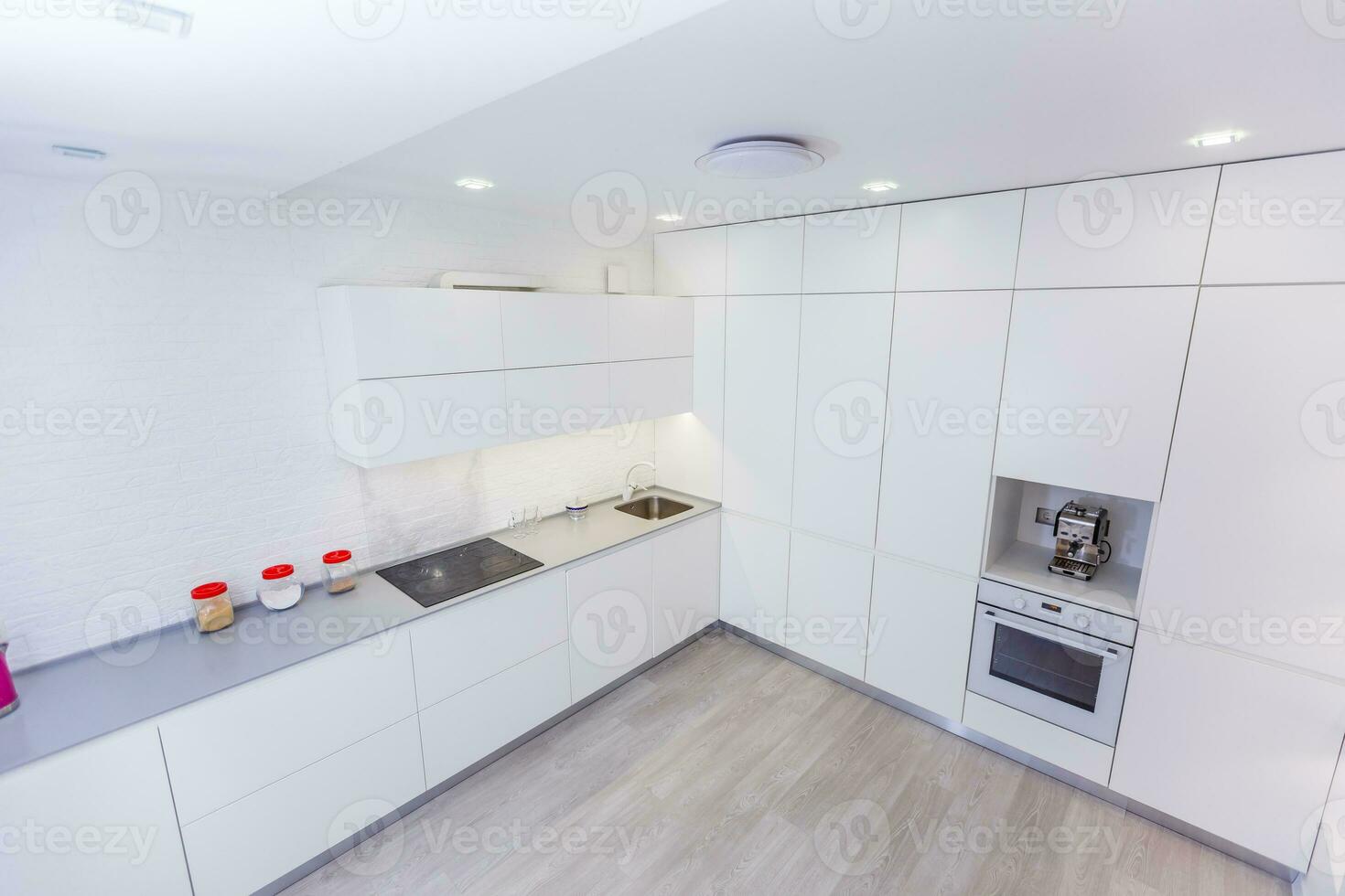 Modern white kitchen without handles photo