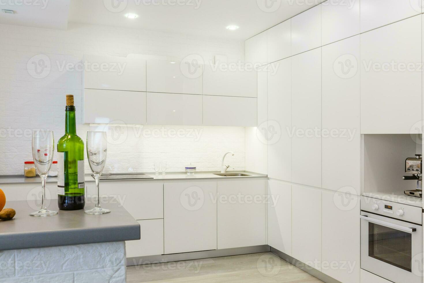 White and beige kitchen interior with bar Stock Photo by