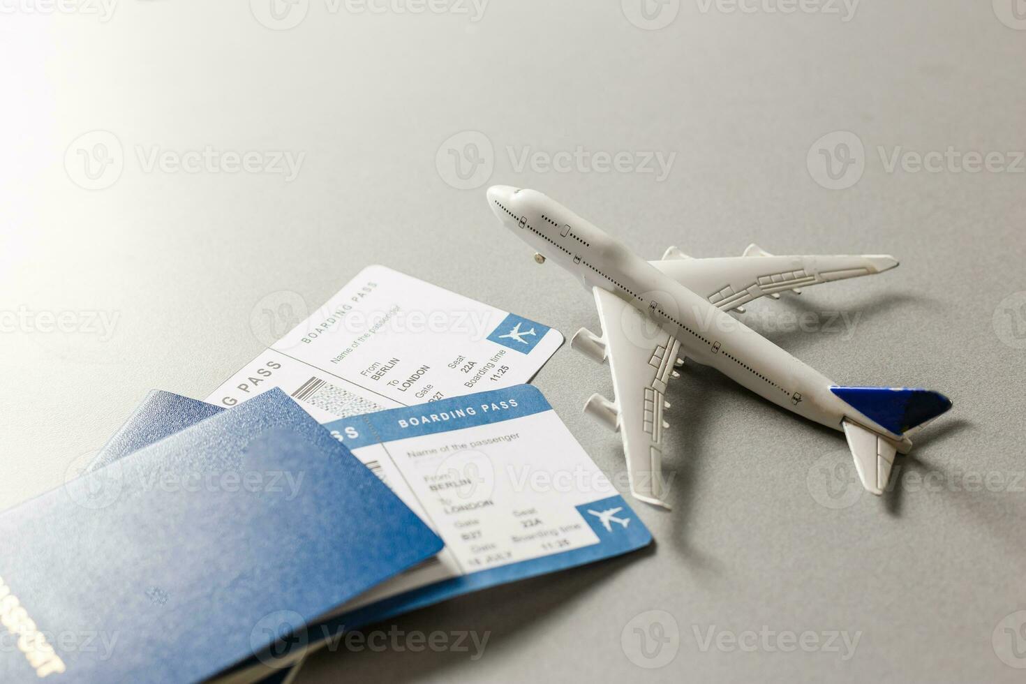 Flight tickets with passports, model of airplane, isolated on white background. photo