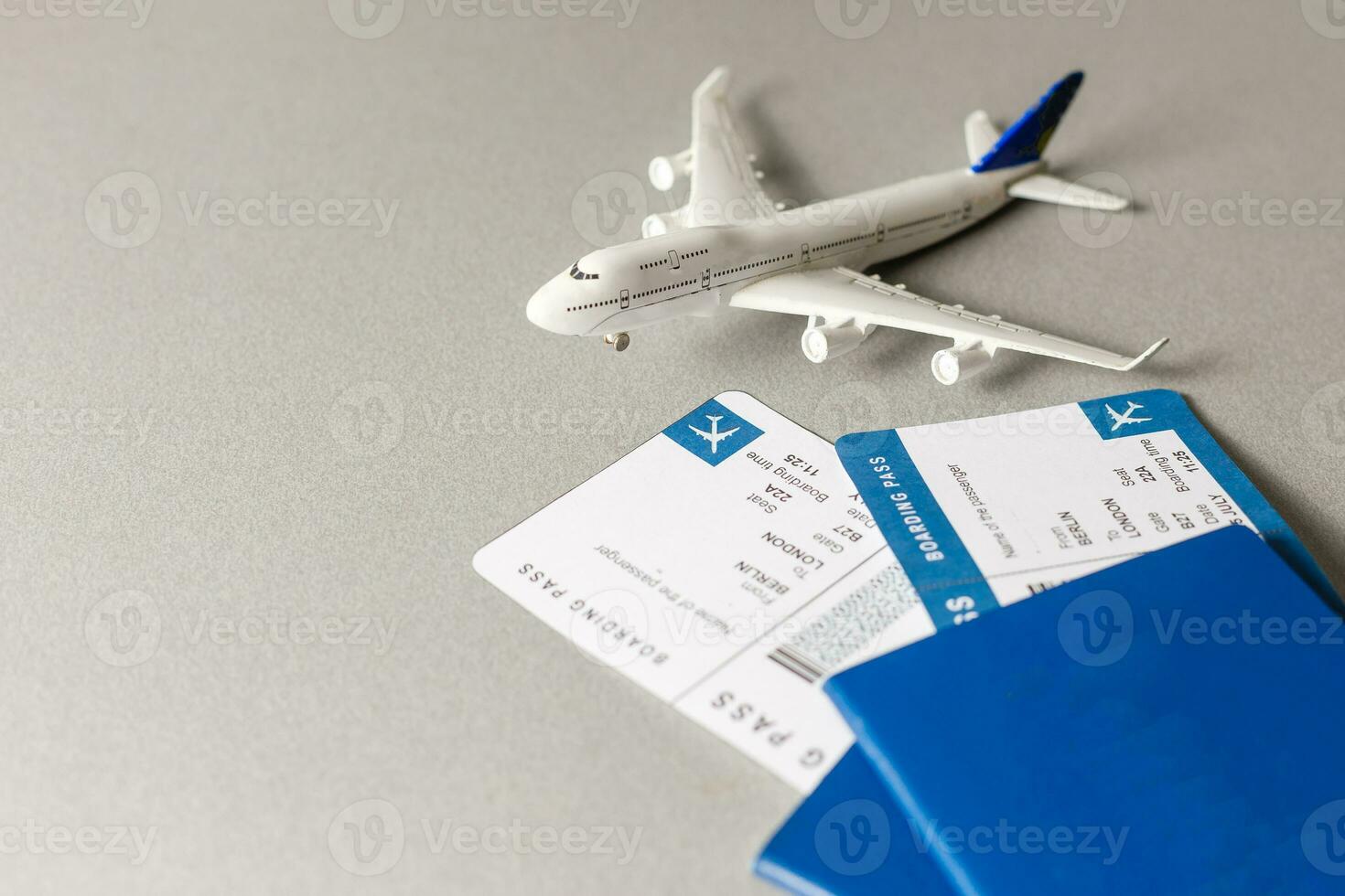 Flight tickets with passports, model of airplane, isolated on white background. photo