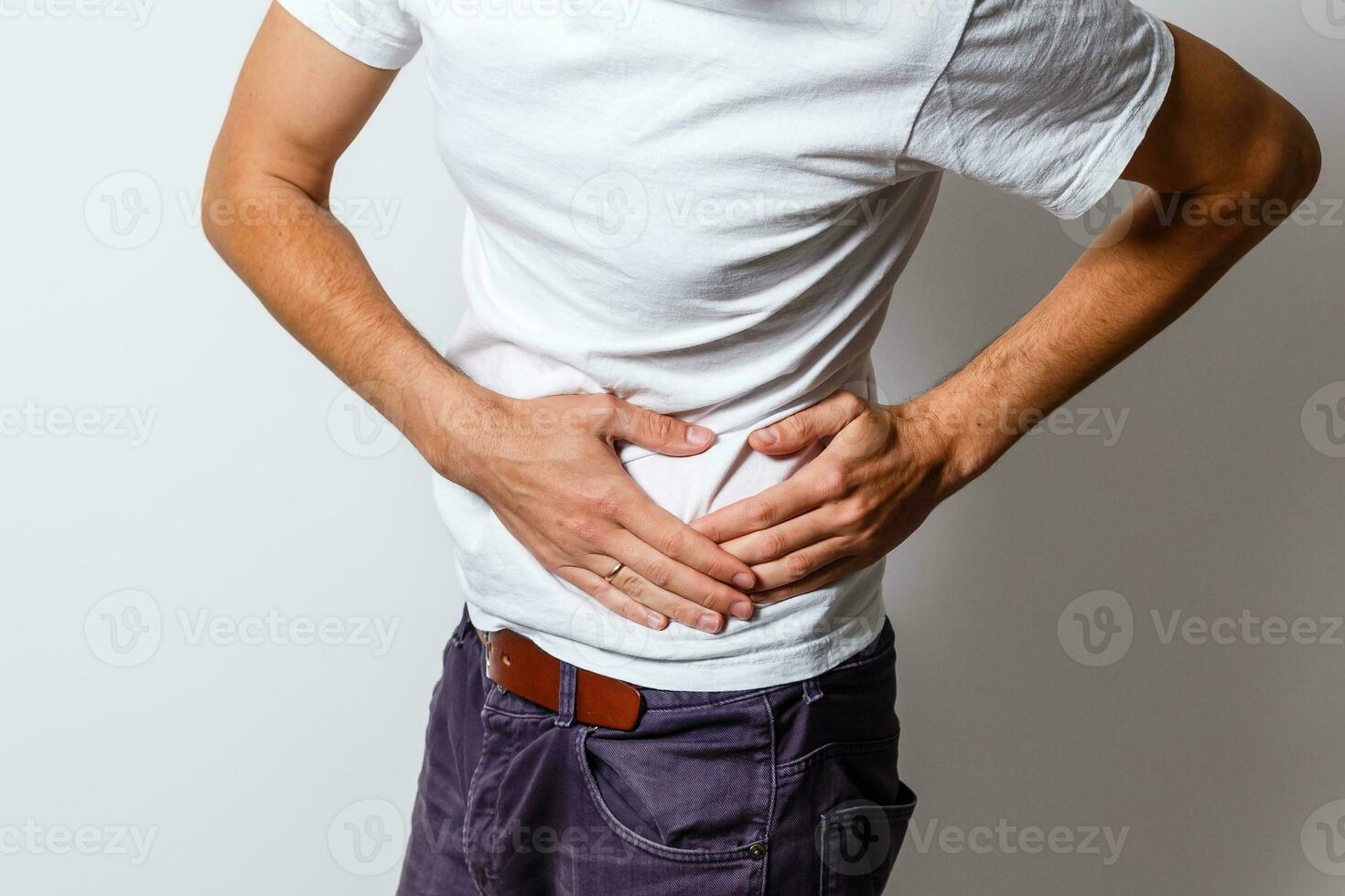 A man has a stomach ache photo