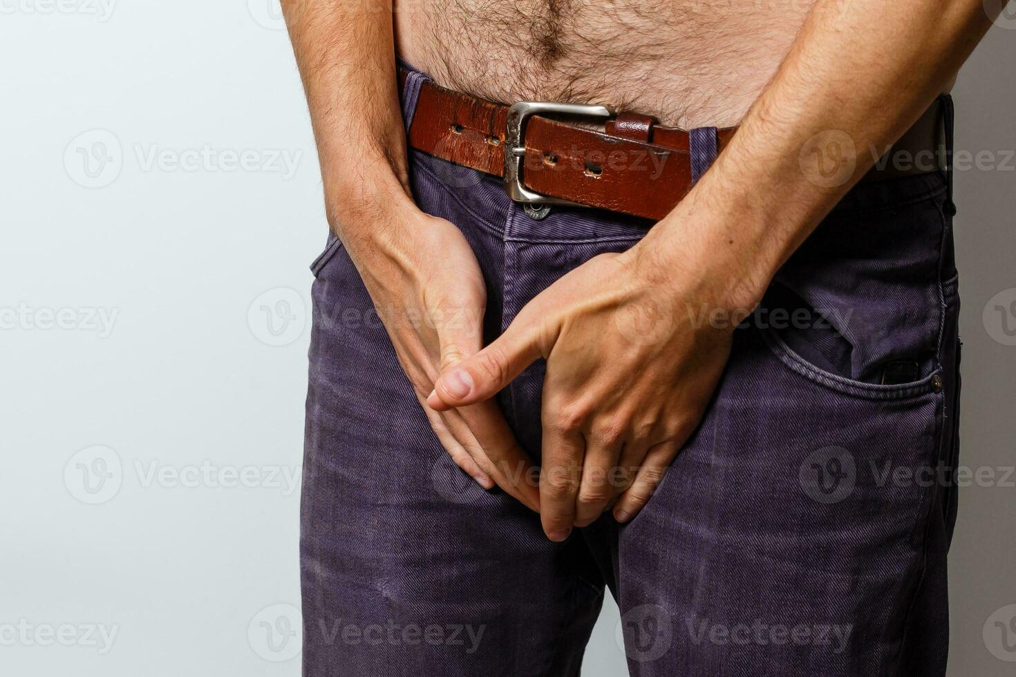 Man wanting to the toilet and holding his groin on white background photo