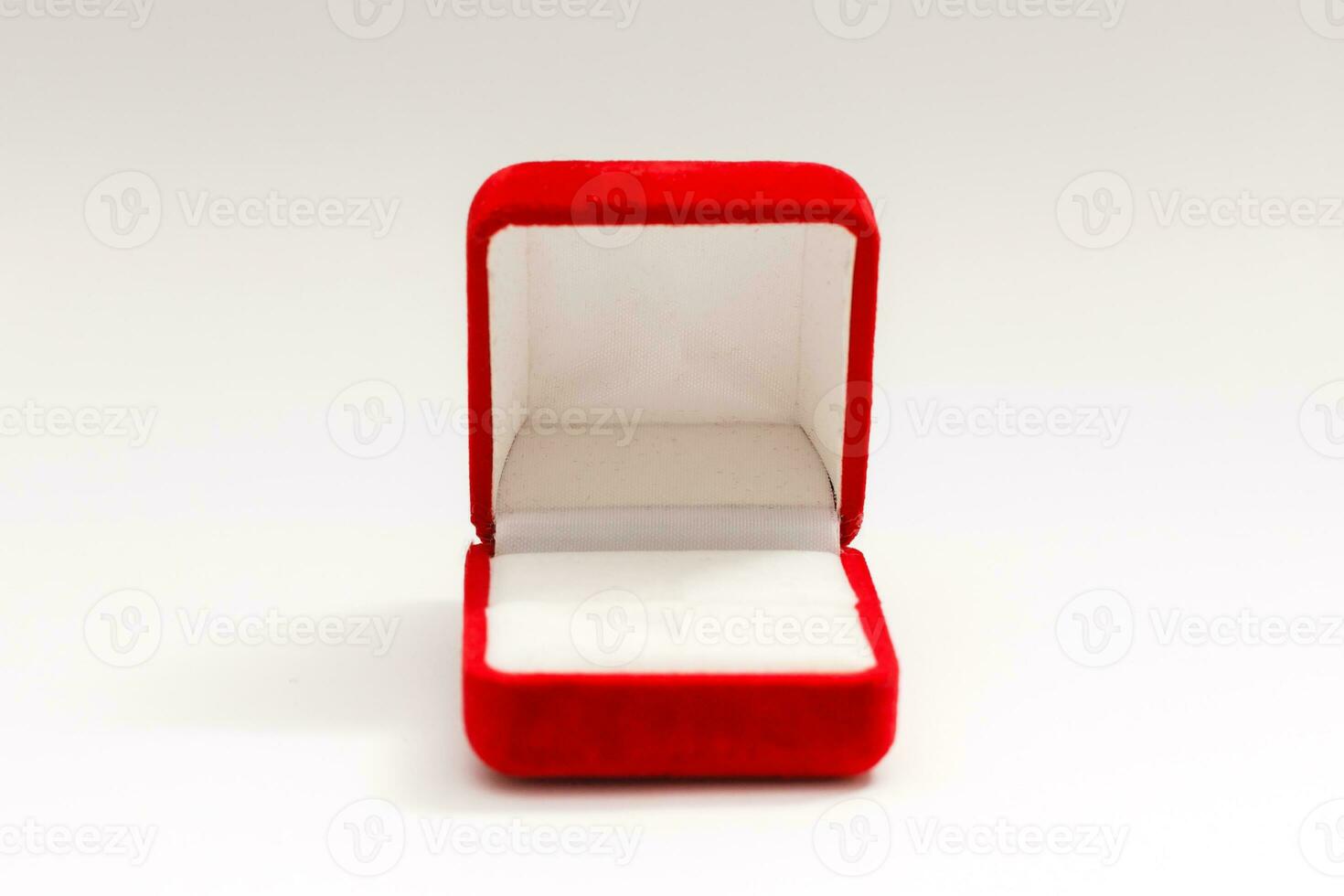 Red velvet box for the ring, opened, isolated over the white background photo