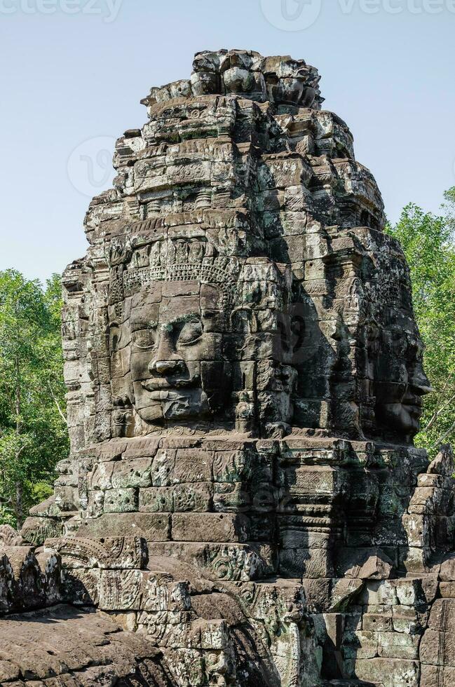 Smiling Faces of Bayon Temple in Angkor Thom at Siem Reap Province of Cambodia photo