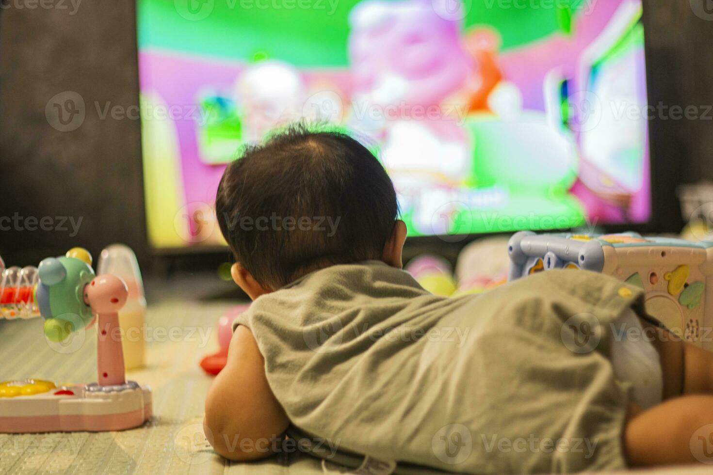 Baby Looking Television In Bedroom photo