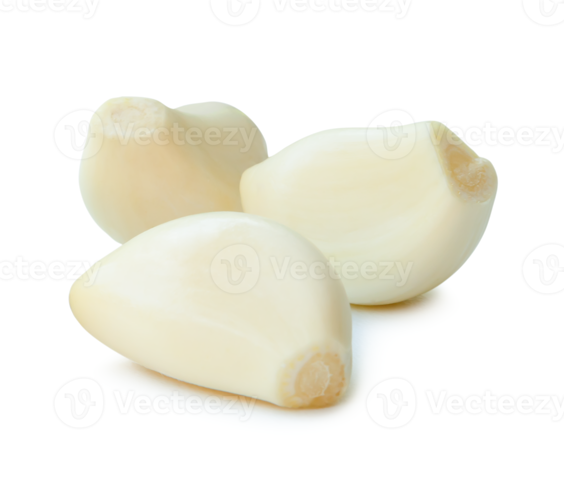 Peeled garlic cloves in stack isolated with clipping path and shadow in png file format.