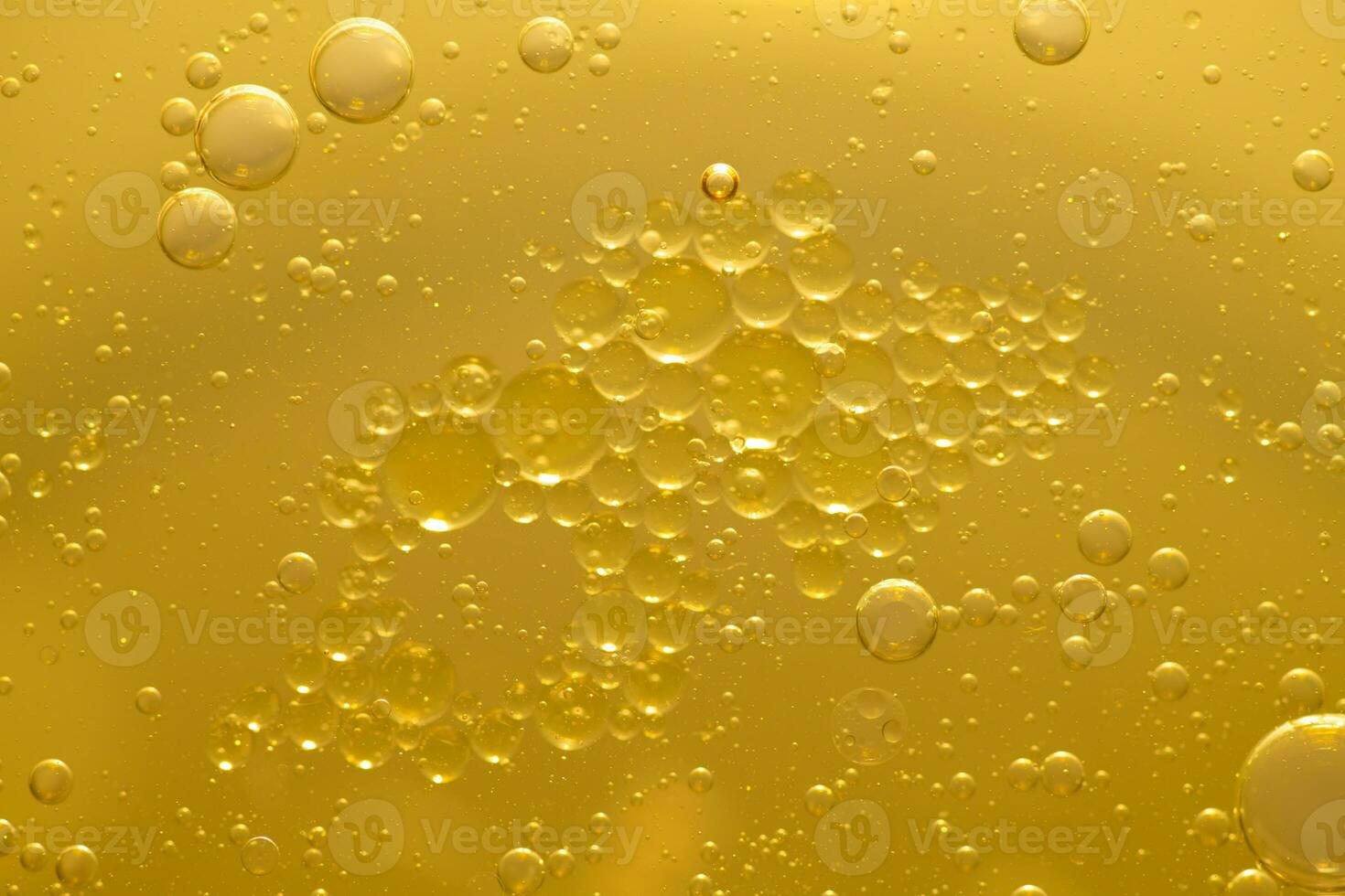 Oil bubble texture on gold background. photo