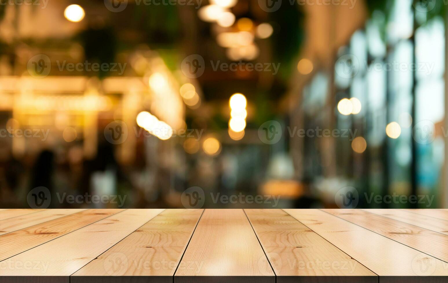 Empty wooden table top with lights bokeh on blur restaurant background photo