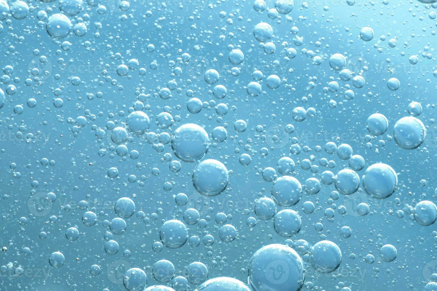 Water bubble texture on blue background photo