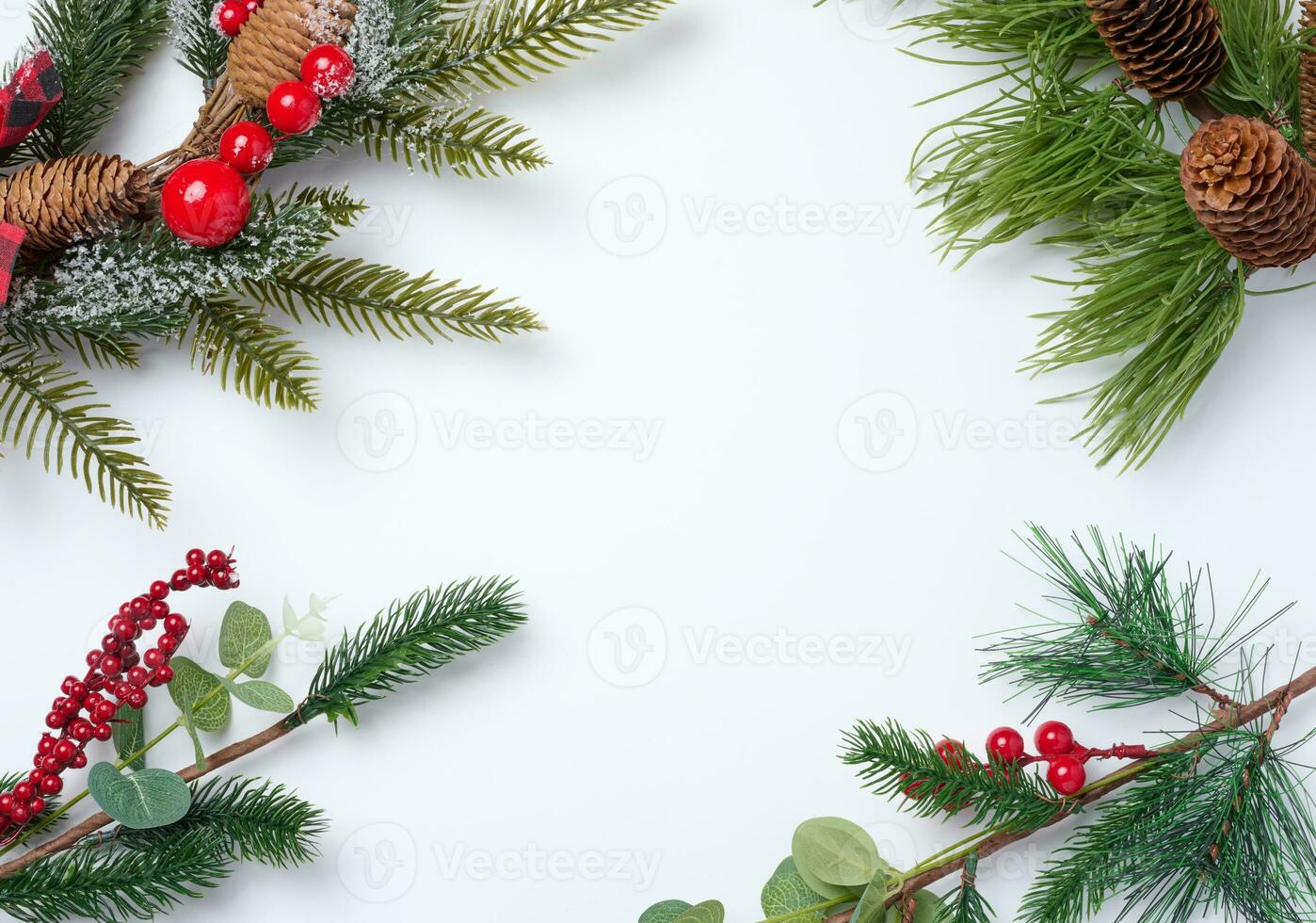 Christmas fir branches with decor on a white background, top view photo