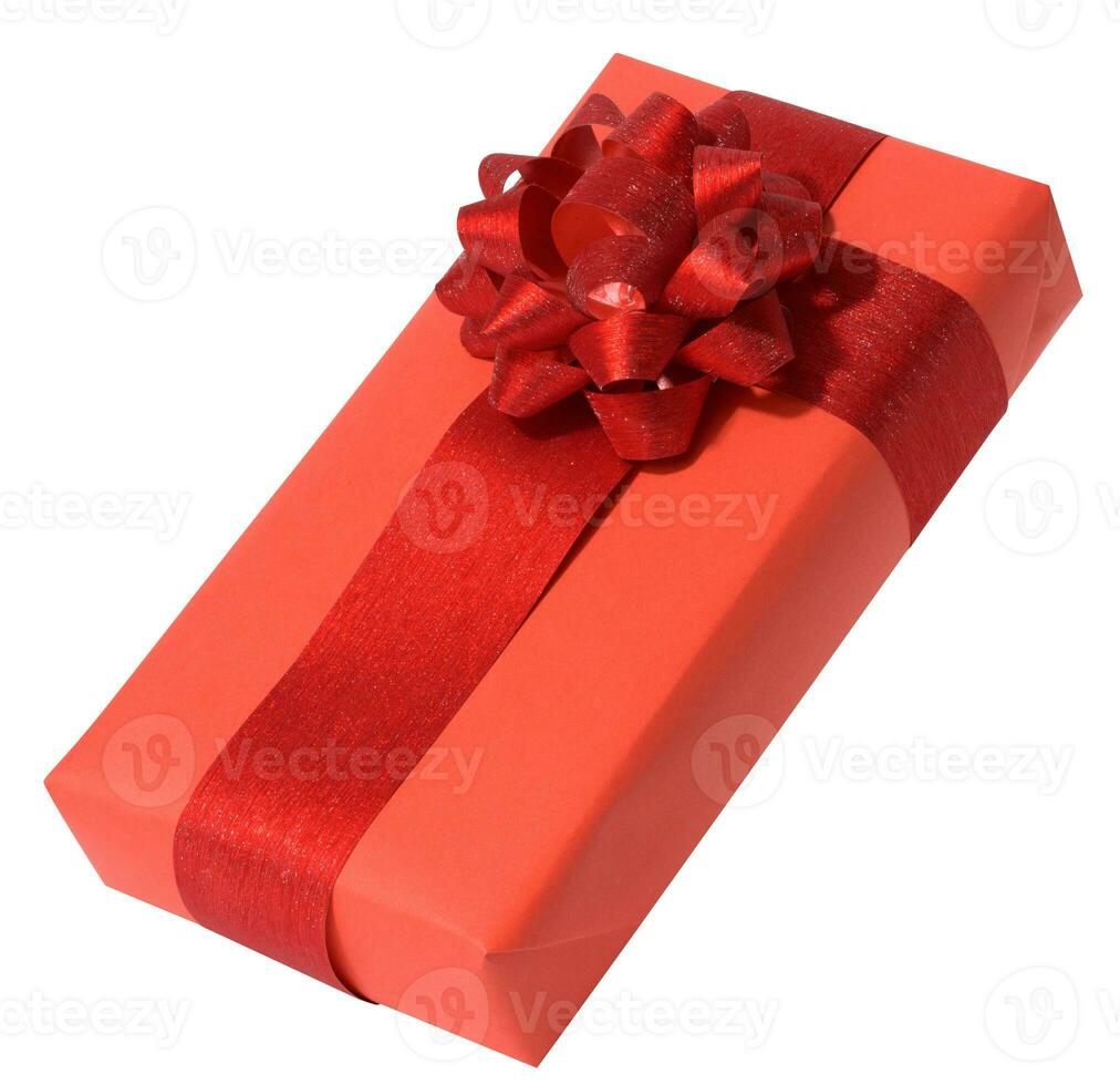 Box is wrapped in red gift wrapping and red ribbon on a white isolated background photo